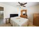 Comfortable bedroom featuring a wooden dresser, ceiling fan, and neutral tones at 3121 Fontana Colony Ct, North Las Vegas, NV 89031