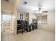 Bedroom features tile flooring, ceiling fan, and an open door to the ensuite bathroom at 3121 Fontana Colony Ct, North Las Vegas, NV 89031