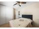 Bedroom featuring a ceiling fan, double closet, and an ensuite bathroom at 3121 Fontana Colony Ct, North Las Vegas, NV 89031