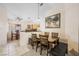 Dining area adjacent to kitchen with tile floors, neutral paint and sight lines to kitchen at 3121 Fontana Colony Ct, North Las Vegas, NV 89031