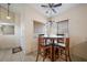 Bright dining area features tile flooring, a ceiling fan, and large windows at 3121 Fontana Colony Ct, North Las Vegas, NV 89031