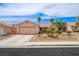 Charming single-story home with desert landscaping, mature palm trees and two-car garage at 3121 Fontana Colony Ct, North Las Vegas, NV 89031