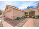 Single-story home featuring a drought-tolerant front yard with gravel and stone at 3121 Fontana Colony Ct, North Las Vegas, NV 89031