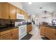 Updated kitchen with a center island, modern appliances, and a tile backsplash at 3121 Fontana Colony Ct, North Las Vegas, NV 89031
