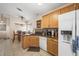 Modern kitchen with a central island, updated appliances, and a breakfast nook at 3121 Fontana Colony Ct, North Las Vegas, NV 89031