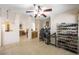 Spacious living room with tile flooring, open layout, and seamless transitions to other living spaces at 3121 Fontana Colony Ct, North Las Vegas, NV 89031