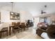 Open-concept living and dining area with tile floors, neutral paint and natural light at 3121 Fontana Colony Ct, North Las Vegas, NV 89031