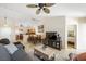 Open-concept living area featuring tile floors, neutral paint and sight lines to dining area at 3121 Fontana Colony Ct, North Las Vegas, NV 89031