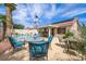 Inviting backyard patio with comfortable seating near refreshing pool at 3121 Fontana Colony Ct, North Las Vegas, NV 89031