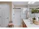 Well-lit bathroom with a white tiled walk-in shower and a single vanity at 3185 Mura Del Prato Ave, Henderson, NV 89044