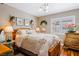 Cozy bedroom featuring floral bedding, decorative accents, and natural light at 3185 Mura Del Prato Ave, Henderson, NV 89044