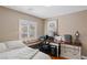 Functional bedroom with a built-in desk, comfortable bed, and neutral decor at 3185 Mura Del Prato Ave, Henderson, NV 89044