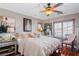 Comfortable bedroom with hardwood floors, soft lighting, and serene ambiance at 3185 Mura Del Prato Ave, Henderson, NV 89044