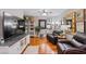 Spacious living room boasts hardwood floors, ample seating, and decorative wall art at 3185 Mura Del Prato Ave, Henderson, NV 89044