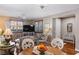 Inviting living room featuring hardwood floors, neutral colors, and comfortable seating at 3185 Mura Del Prato Ave, Henderson, NV 89044