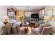 Comfortable living room boasts hardwood floors, cozy seating, and ample natural light at 3185 Mura Del Prato Ave, Henderson, NV 89044