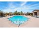 Resort-style pool with lounge chairs and lush landscaping in a community setting at 3185 Mura Del Prato Ave, Henderson, NV 89044