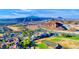 Stunning aerial view of a Las Vegas community with golf course and mountain views at 35 Via Rizzuto, Henderson, NV 89011