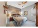 Cozy bedroom featuring a statement wood accent wall and neutral color palette at 35 Via Rizzuto, Henderson, NV 89011