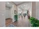 Spacious entryway leading to an open floor plan, featuring wood-look floors and modern lighting at 35 Via Rizzuto, Henderson, NV 89011
