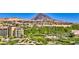 Picturesque view of the golf course and mountain range showcasing lush greenery and upscale community at 35 Via Rizzuto, Henderson, NV 89011