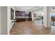 Spacious living area flowing into the kitchen, complete with wood floors and ample bar area at 35 Via Rizzuto, Henderson, NV 89011
