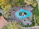 Beautiful aerial view of a resort-style pool surrounded by lush landscaping and lounge chairs at 4200 S Valley View Blvd # 1007, Las Vegas, NV 89103