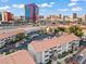 Expansive view of condos with orange tile roofs and a vibrant Las Vegas skyline in the background at 4200 S Valley View Blvd # 1007, Las Vegas, NV 89103