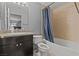 Well-maintained bathroom with a shower-tub combo with tile surround and vanity at 4200 S Valley View Blvd # 1007, Las Vegas, NV 89103