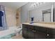 This bathroom features a shower-tub, granite vanity, and cabinets, providing a comfortable space at 4200 S Valley View Blvd # 1007, Las Vegas, NV 89103