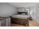 This bedroom has an inviting ambiance, with a warm wood bed frame and soft, natural light at 4200 S Valley View Blvd # 1007, Las Vegas, NV 89103