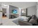 Cozy living room features a comfortable sofa, a modern TV, and sliding glass doors to a balcony at 4200 S Valley View Blvd # 1007, Las Vegas, NV 89103