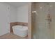Bright bathroom with a sleek soaking tub and a separate glass-enclosed shower at 4525 Dean Martin Dr # 2109, Las Vegas, NV 89103