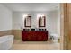 Modern bathroom featuring a double vanity, soaking tub, separate shower, and sleek tile flooring at 4525 Dean Martin Dr # 2109, Las Vegas, NV 89103
