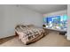 Simple bedroom featuring carpeted floors, and a window offering city views at 4525 Dean Martin Dr # 2109, Las Vegas, NV 89103
