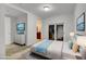 Modern bedroom with white walls, a plush bed, and a view into the bathroom at 4525 Dean Martin Dr # 2109, Las Vegas, NV 89103