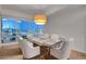 A well-lit dining room has seating for six and breathtaking city views at 4525 Dean Martin Dr # 2109, Las Vegas, NV 89103
