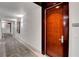 Hallway view with neutral carpet and modern lighting leading to unit door at 4525 Dean Martin Dr # 2109, Las Vegas, NV 89103