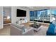Bright living room with city views and modern furniture arrangement at 4525 Dean Martin Dr # 2109, Las Vegas, NV 89103