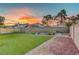 Well-kept backyard featuring artificial grass and gardening space at 4556 Kenilworth Ct, Las Vegas, NV 89147