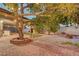 Backyard brick patio with string lights, artificial grass, and gravel at 4556 Kenilworth Ct, Las Vegas, NV 89147