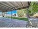 Outdoor space featuring a covered patio, synthetic grass, shed, and well-maintained landscaping at 4556 Kenilworth Ct, Las Vegas, NV 89147