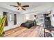 Spacious bedroom with a ceiling fan, natural light, and vinyl flooring at 4556 Kenilworth Ct, Las Vegas, NV 89147