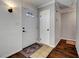 Inviting entryway with decorative front door, tile accents and wood flooring at 4556 Kenilworth Ct, Las Vegas, NV 89147