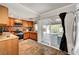Well-equipped kitchen with stainless steel appliances and sliding door access to the backyard at 4556 Kenilworth Ct, Las Vegas, NV 89147