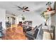 Inviting living room with hardwood floors, ceiling fan, and ample natural light at 4556 Kenilworth Ct, Las Vegas, NV 89147
