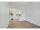 Sunlit living room features minimalist decor, light wood floors, and neutral walls for a modern, open feel at 5171 Lindell Rd # 201, Las Vegas, NV 89118
