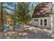 Spacious backyard patio with an array of lounge chairs and other seating at 5230 Whispering Robin Ln, Mount Charleston, NV 89124