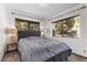 Bedroom featuring neutral walls, carpeted floors and natural light from the large windows at 5230 Whispering Robin Ln, Mount Charleston, NV 89124