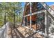 A-frame home features a spacious deck and large windows offering natural light and beautiful views at 5230 Whispering Robin Ln, Mount Charleston, NV 89124